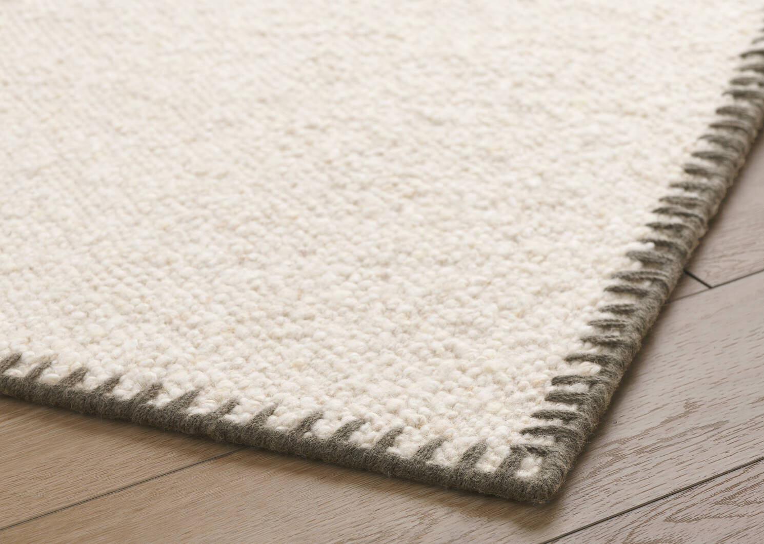 Classic Elegance Wool Rug: Handcrafted wool rug with a minimalist design.